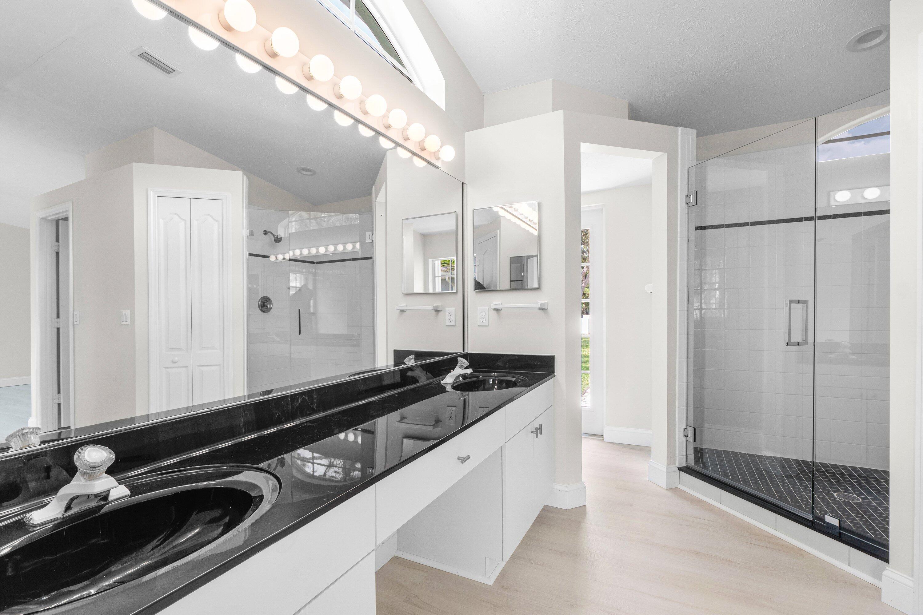 6807 Shelley Terrace Port St. Lucie, FL 34952 - Photo 28 of 34 a kitchen with granite countertop a sink and stainless steel appliances