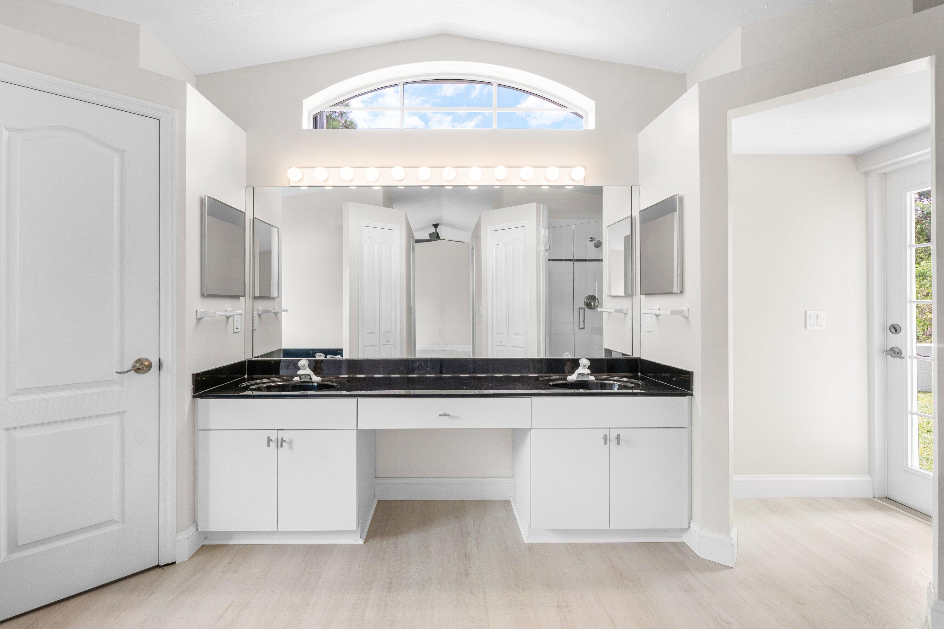 6807 Shelley Terrace Port St. Lucie, FL 34952 - Photo 29 of 34 a bathroom with a sink and a mirror