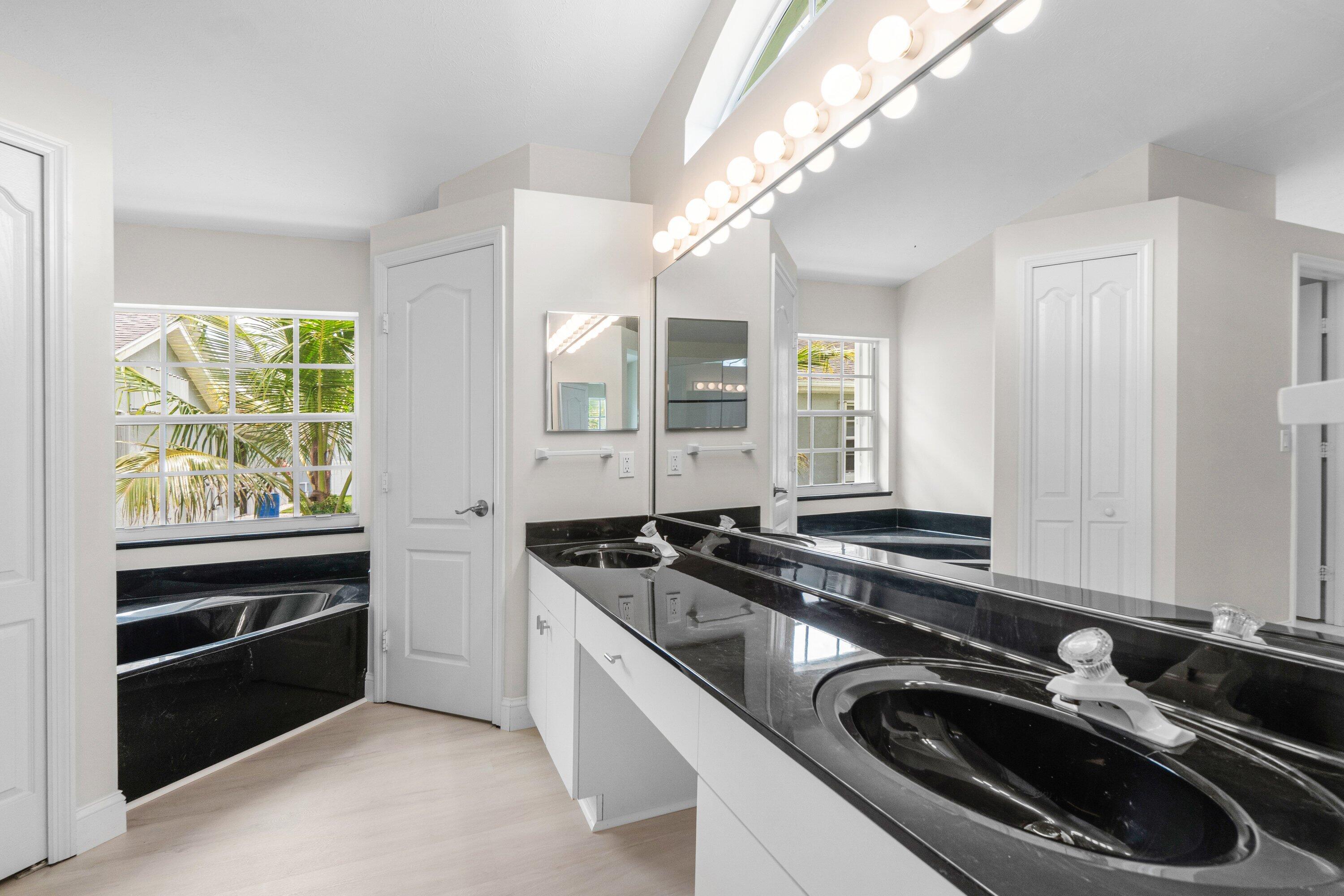 6807 Shelley Terrace Port St. Lucie, FL 34952 - Photo 30 of 34 a kitchen that has a sink and a stove