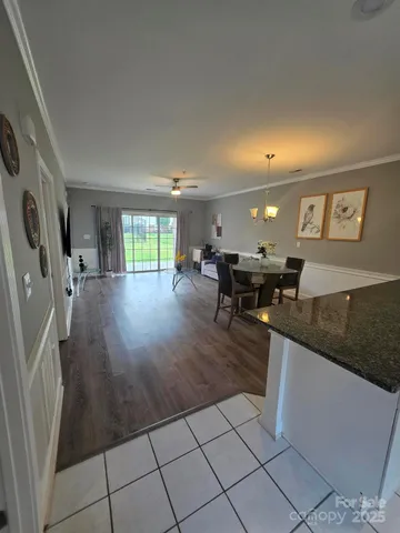 a lobby with furniture and floor to ceiling window