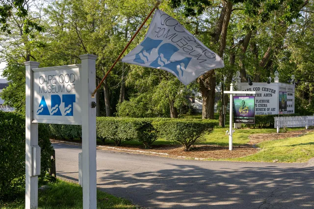 a view of a house with basketball court