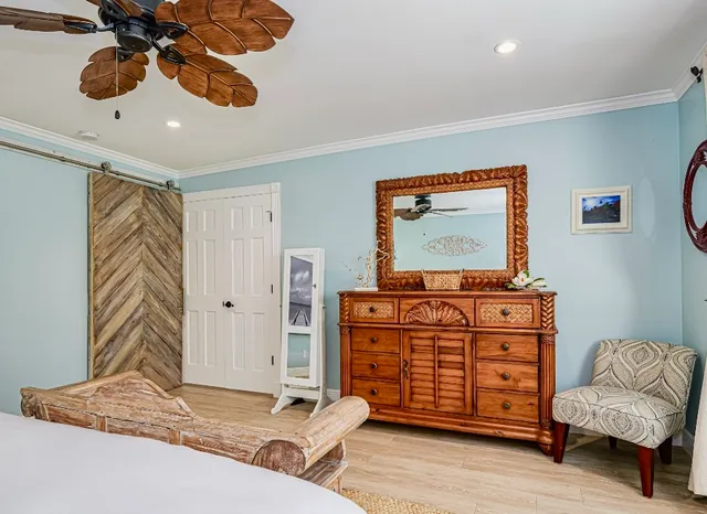 a living room with furniture cabinets and flat screen tv