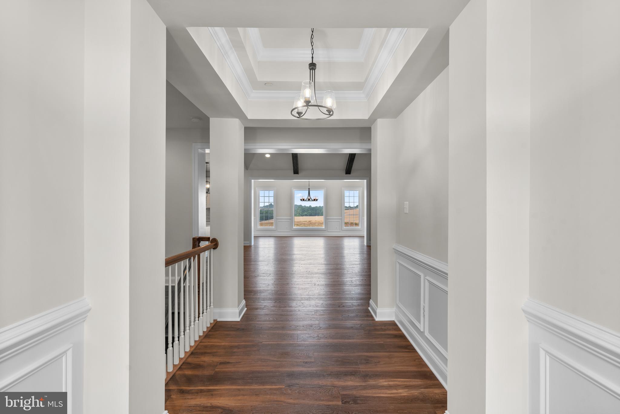14628 Old Hanover Road, Unit REGINA Reisterstown, MD 21136 - Photo 4 of 67 a view of a hallway with wooden floor and staircase