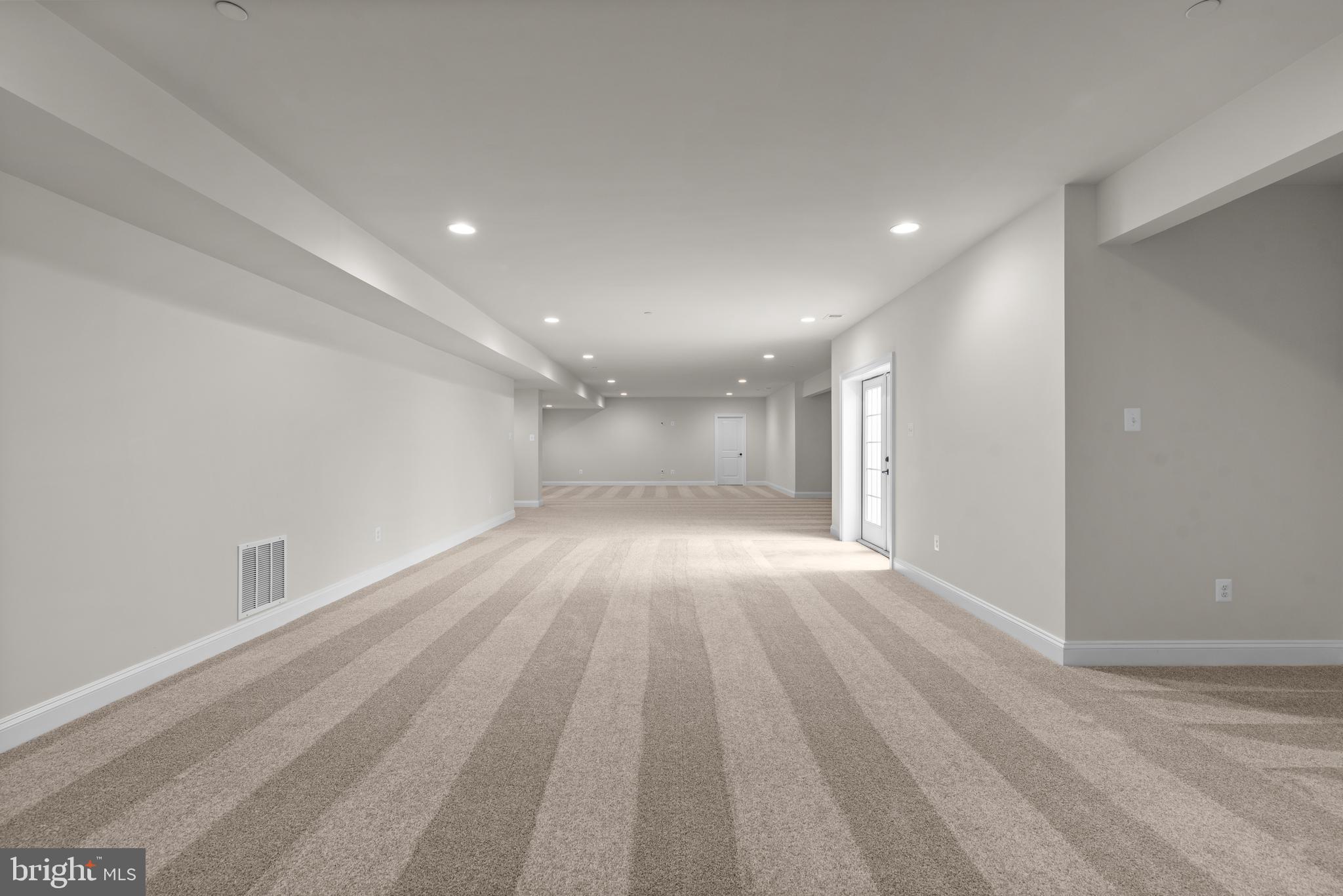 14628 Old Hanover Road, Unit REGINA Reisterstown, MD 21136 - Photo 54 of 67 a view of empty room with wooden floor