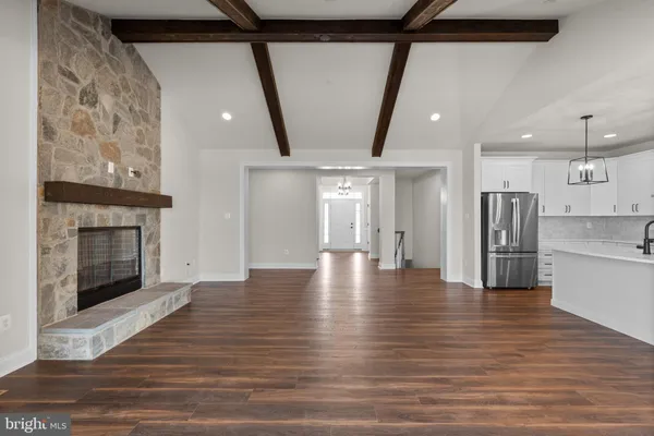 a large kitchen with kitchen island a sink stainless steel appliances and cabinets