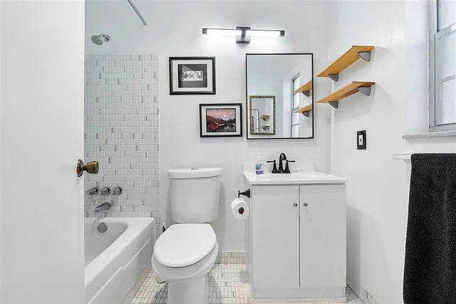 a bathroom with a sink a toilet and a bathtub