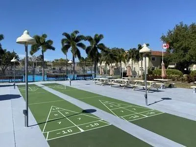 a view of a swimming pool with chairs