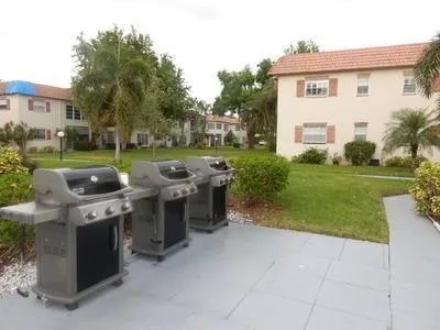 a view of a house with backyard porch and furniture