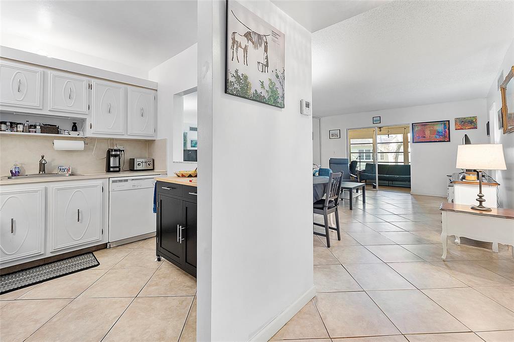 5621 Southwest 2nd Court, Unit 201 Margate, FL 33068 - Photo 5 of 17 a view of kitchen with cabinets and window