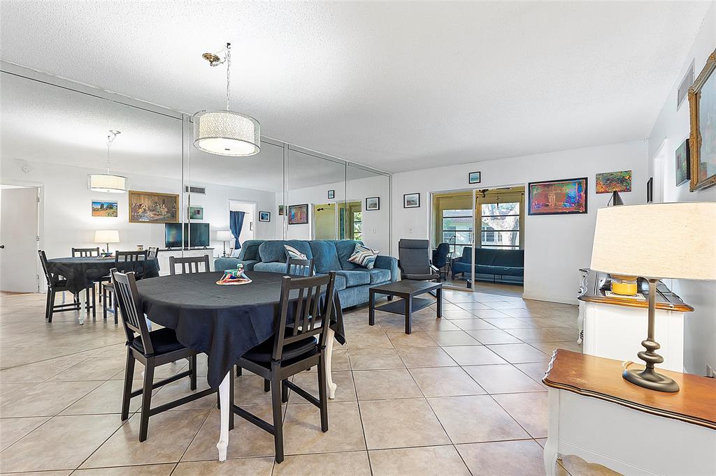 5621 Southwest 2nd Court, Unit 201 Margate, FL 33068 - Photo 7 of 17 a view of a dining room with furniture