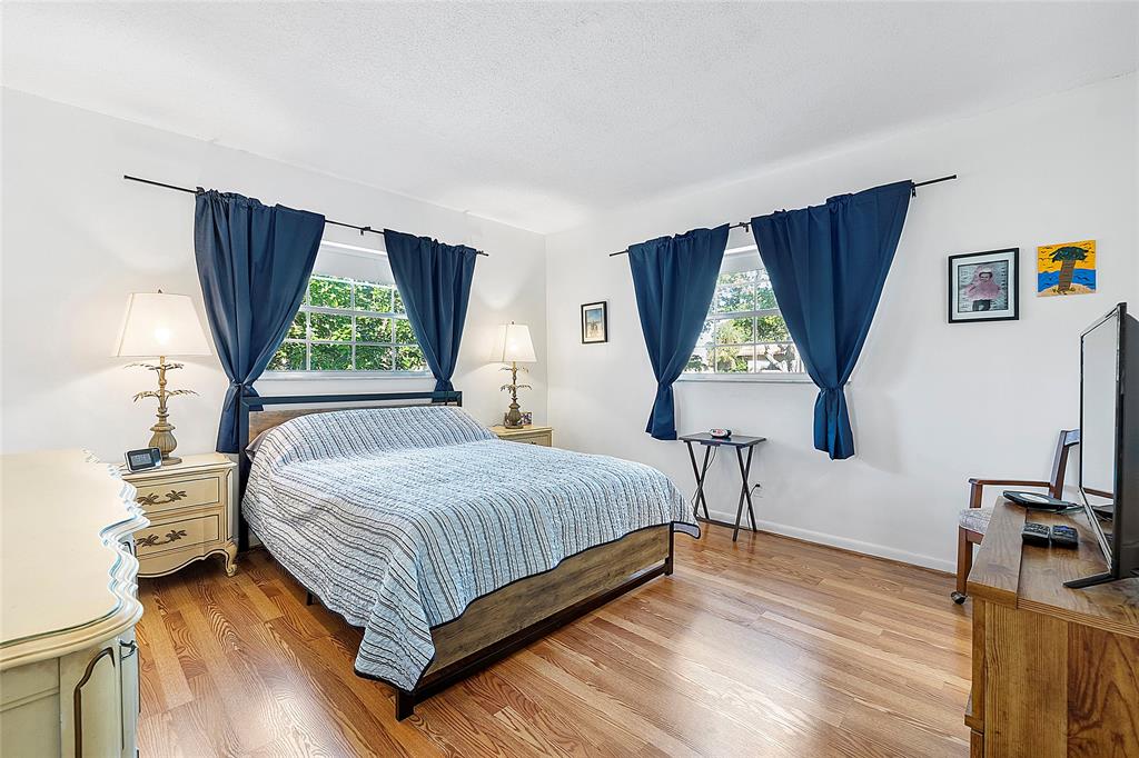 5621 Southwest 2nd Court, Unit 201 Margate, FL 33068 - Photo 9 of 17 a bedroom with a bed and a window