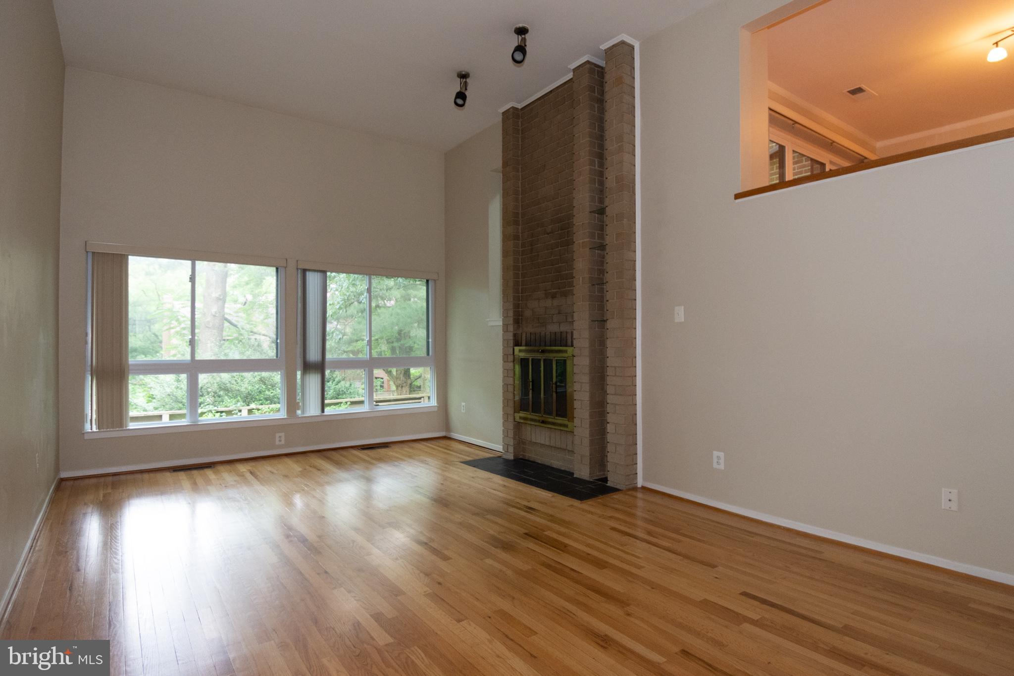 11768 Indian Ridge Road Reston, VA 20191 - Photo 29 of 57 a view of an empty room with wooden floor and a window