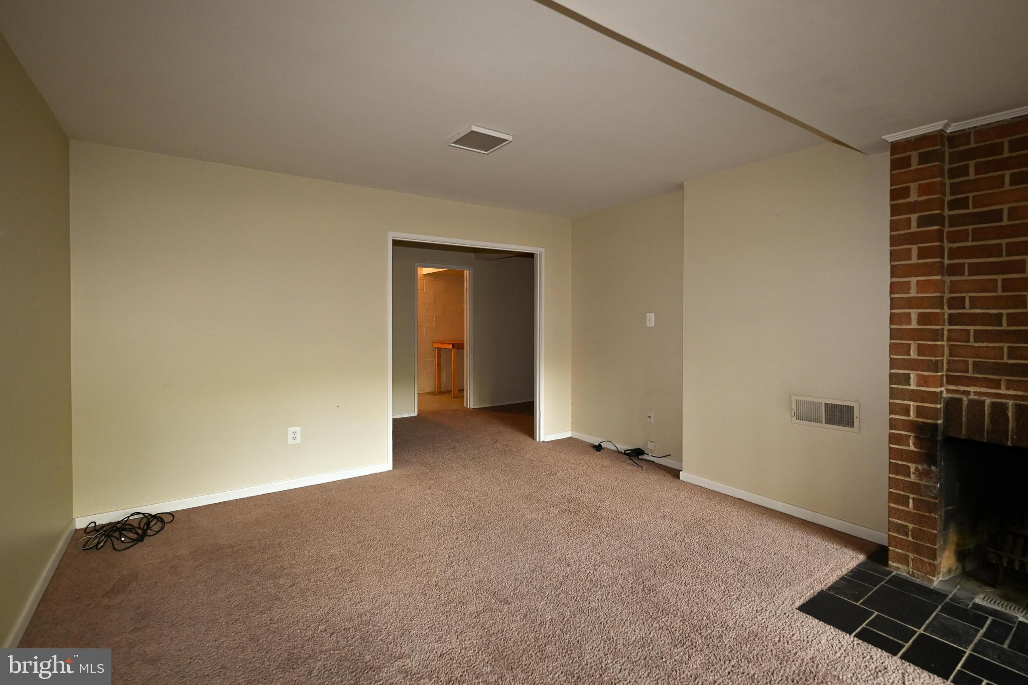 11768 Indian Ridge Road Reston, VA 20191 - Photo 36 of 57 a view of an empty room with a fireplace