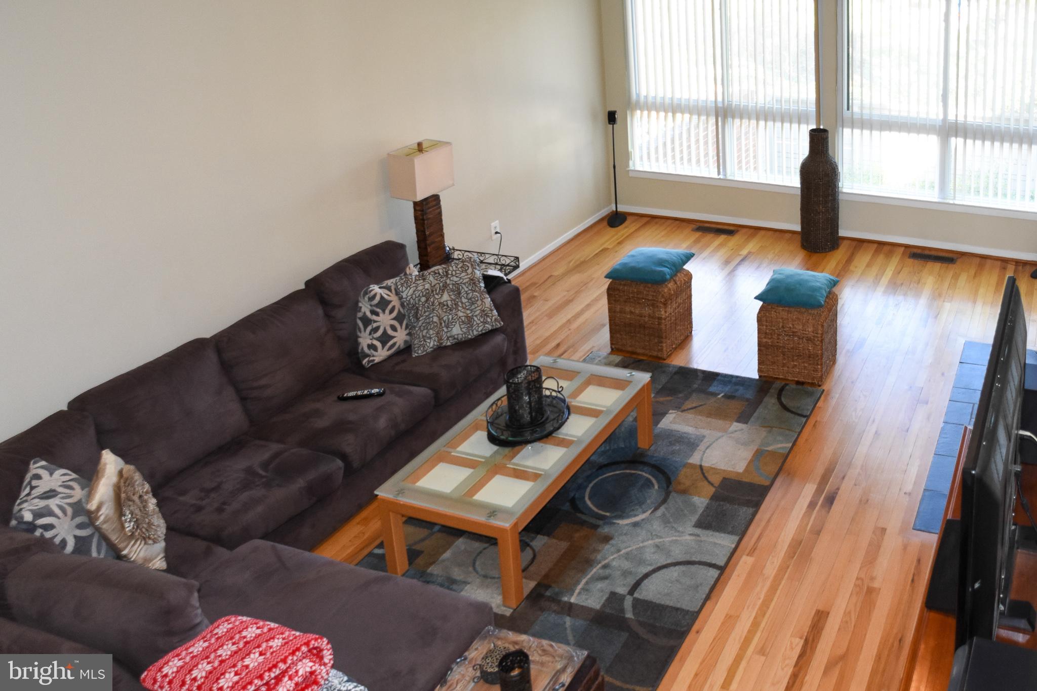 11768 Indian Ridge Road Reston, VA 20191 - Photo 10 of 57 a living room with furniture and a large window