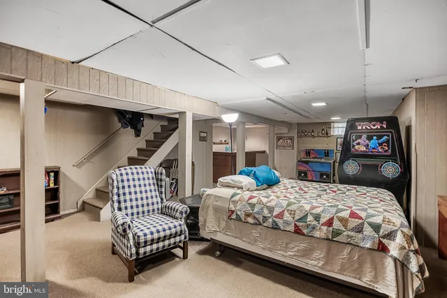 a bedroom with bed and window