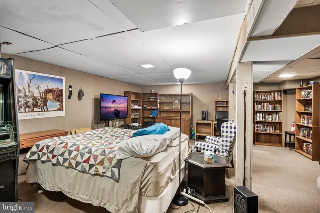 a bedroom with furniture and a bed