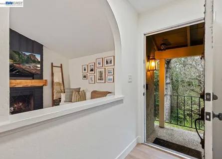 a living room with a fireplace and a flat screen tv