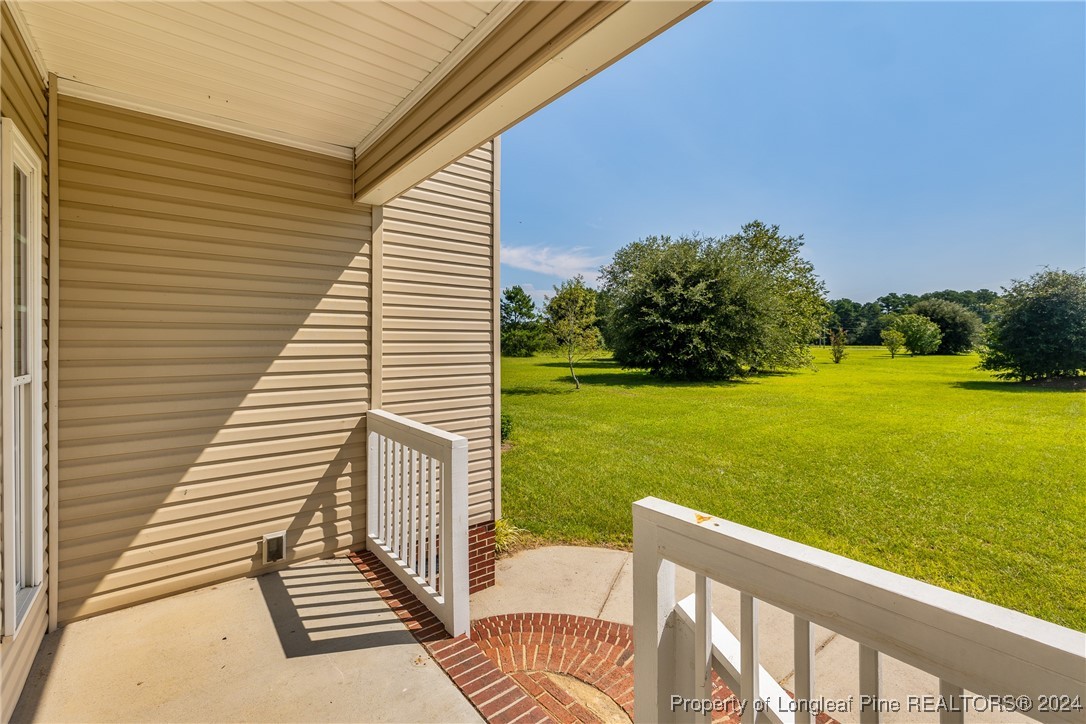 1591 Shannon Road Lumberton, NC 28360 - Photo 9 of 12 a view of a patio with wooden floor