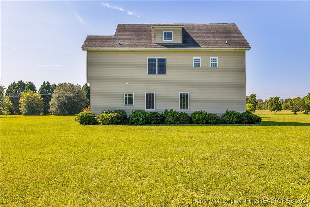 1591 Shannon Road Lumberton, NC 28360 - Photo 10 of 12 a front view of house with an outdoor space