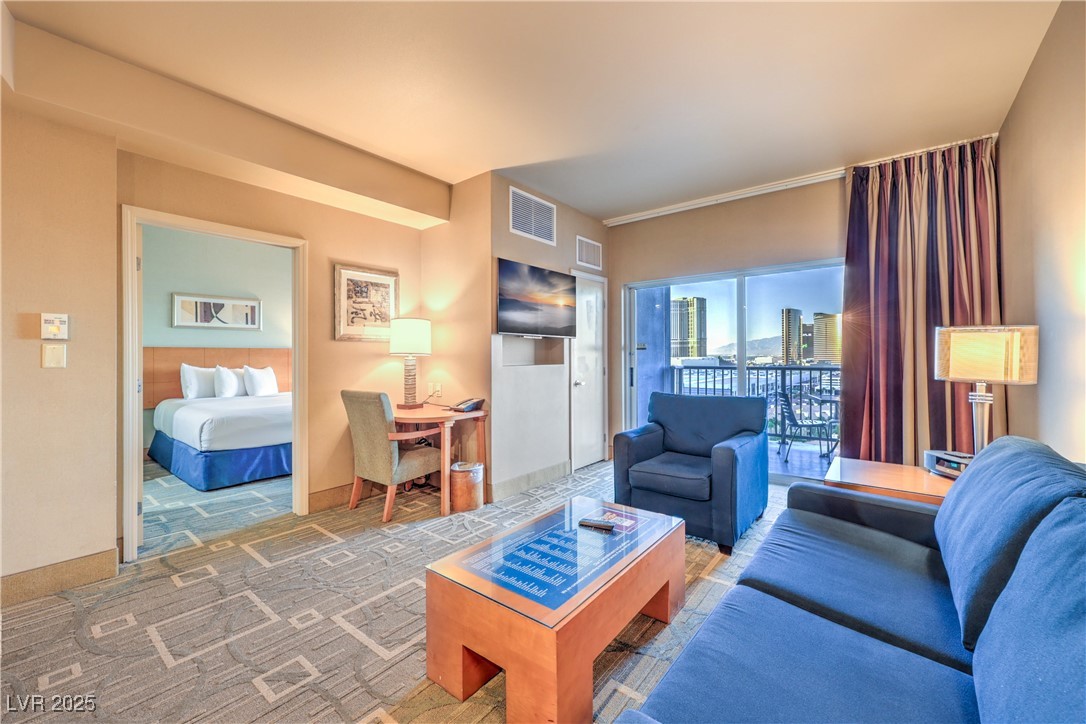 211 East Flamingo Road, Unit 1505 Las Vegas, NV 89169 - Photo 13 of 45 Living room with carpet flooring