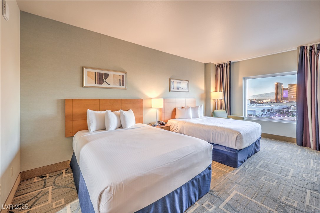 211 East Flamingo Road, Unit 1505 Las Vegas, NV 89169 - Photo 16 of 45 Bedroom featuring baseboards