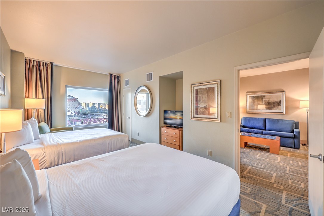 211 East Flamingo Road, Unit 1505 Las Vegas, NV 89169 - Photo 18 of 45 Bedroom featuring carpet flooring