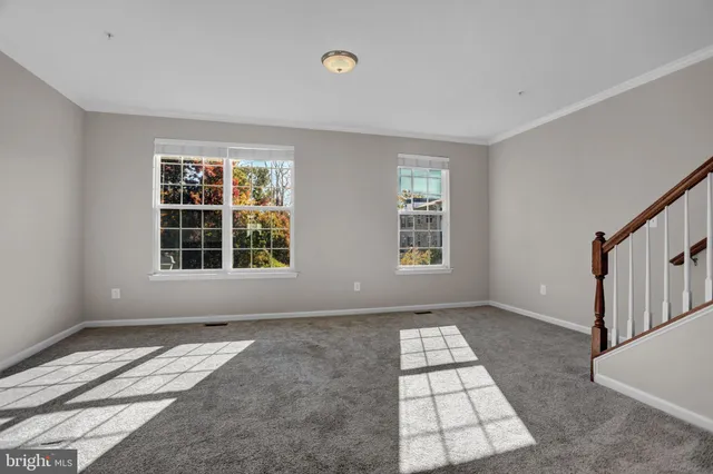 a kitchen with stainless steel appliances granite countertop a refrigerator a stove and a wooden floors