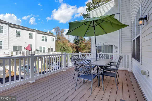 a view of a patio with a table and chairs