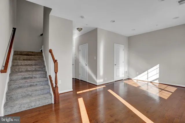 a view of an empty room with stairs