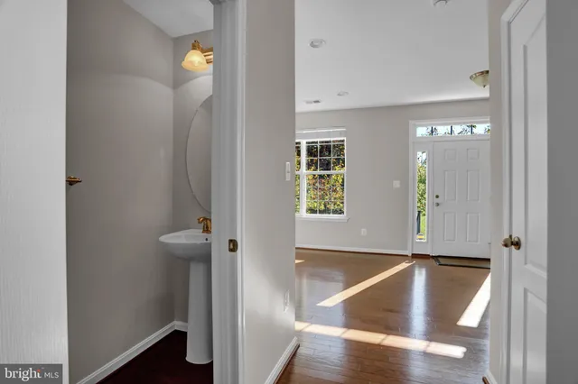a view of a room with wooden floor