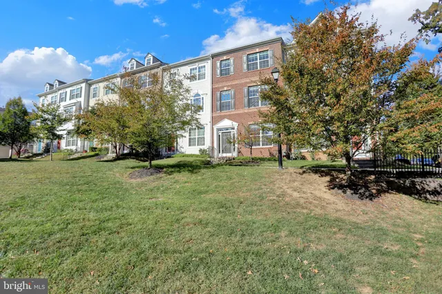 a view of a street with parked cars