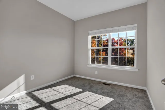 a view of an empty room and bedroom