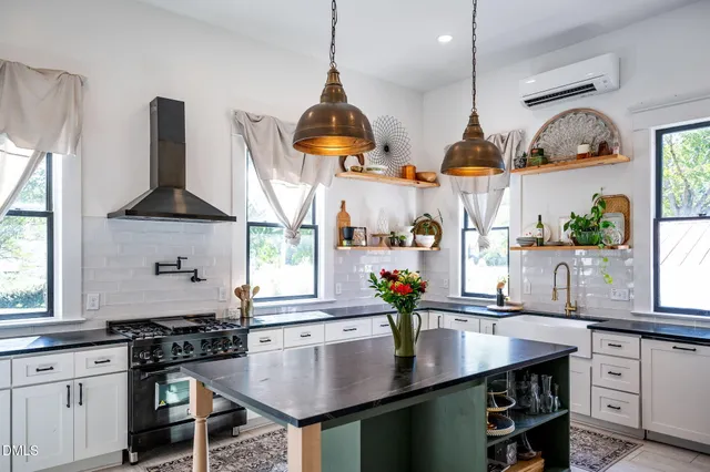 a very nice looking room with wooden floor and a chandelier