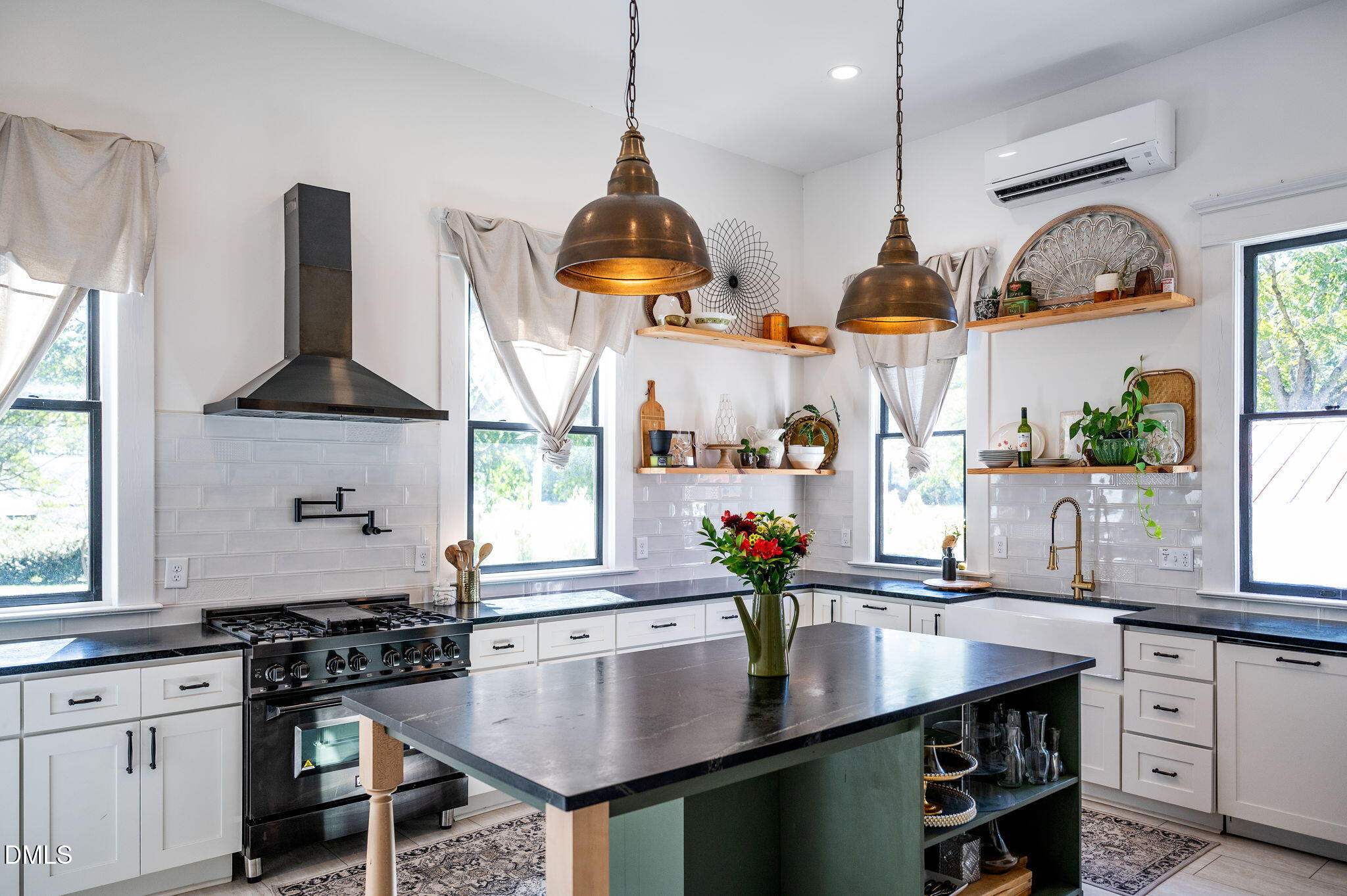 2239 Barber Mill Road Clayton, NC 27520 - Photo 17 of 75 a kitchen with stainless steel appliances a sink a stove and a wooden floor