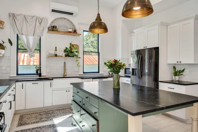 a view of a livingroom with furniture window and wooden floor