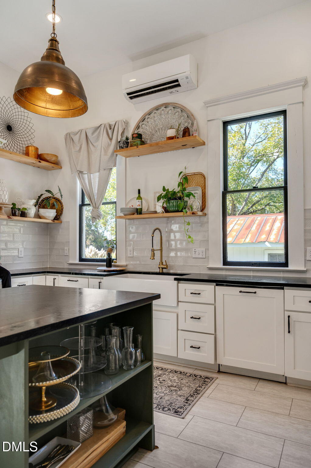 2239 Barber Mill Road Clayton, NC 27520 - Photo 20 of 75 a kitchen with stainless steel appliances a stove and cabinets