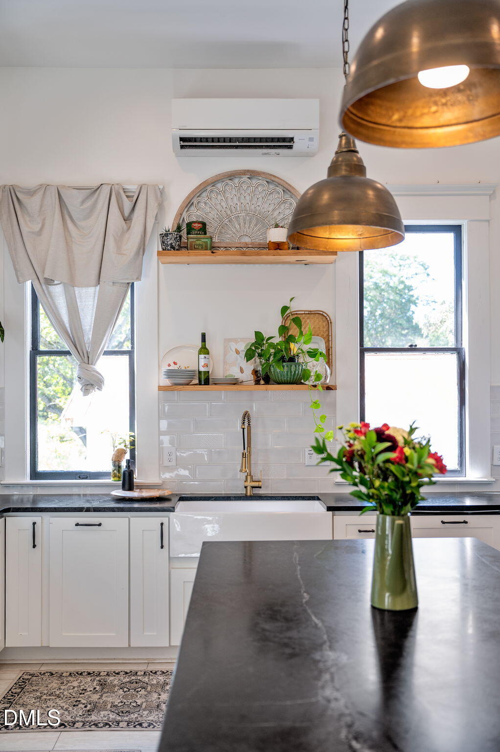 2239 Barber Mill Road Clayton, NC 27520 - Photo 21 of 75 a white vase with flowers sitting on a table