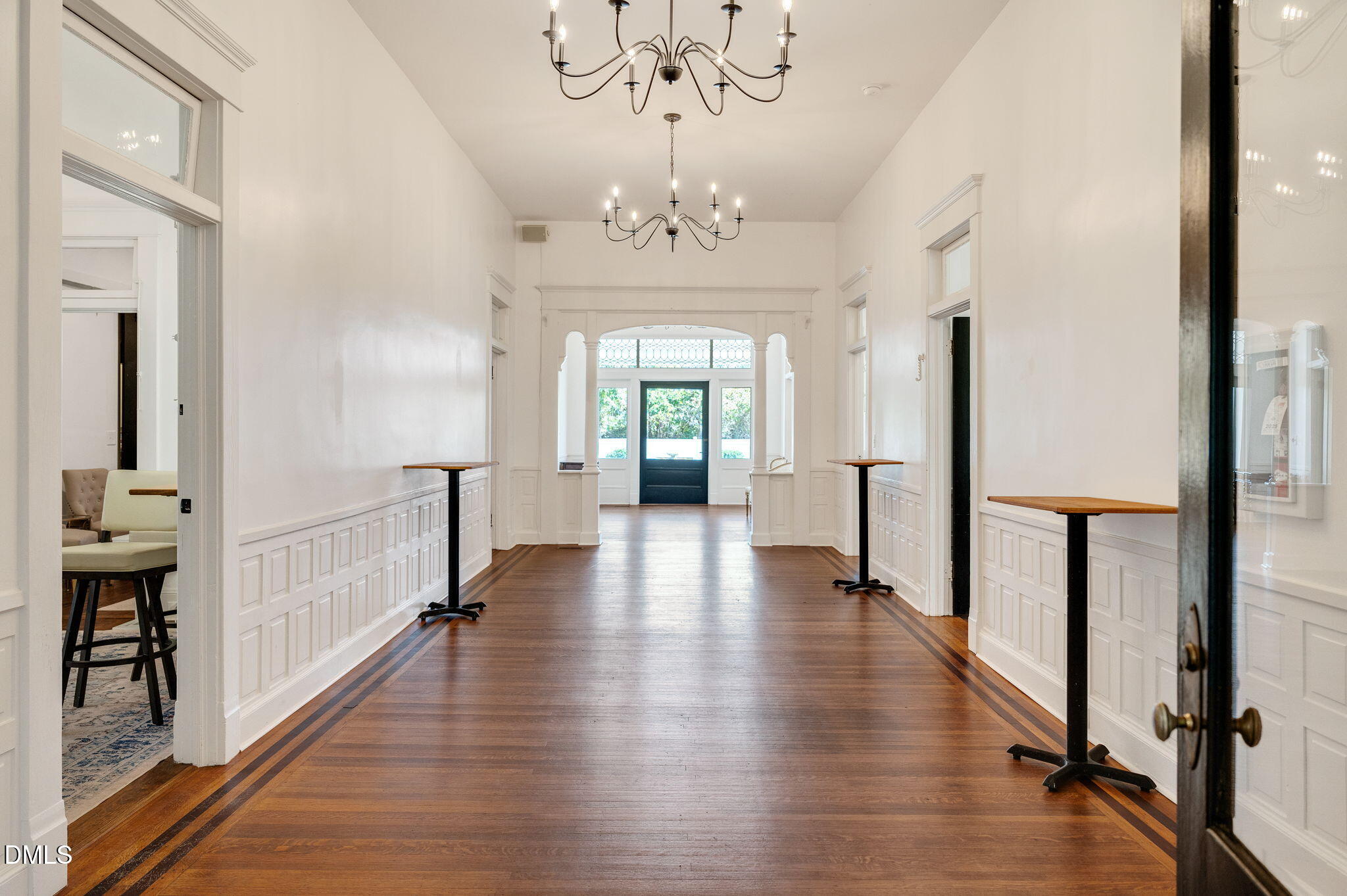 2239 Barber Mill Road Clayton, NC 27520 - Photo 24 of 75 a view of a hallway with wooden floor and a chandelier