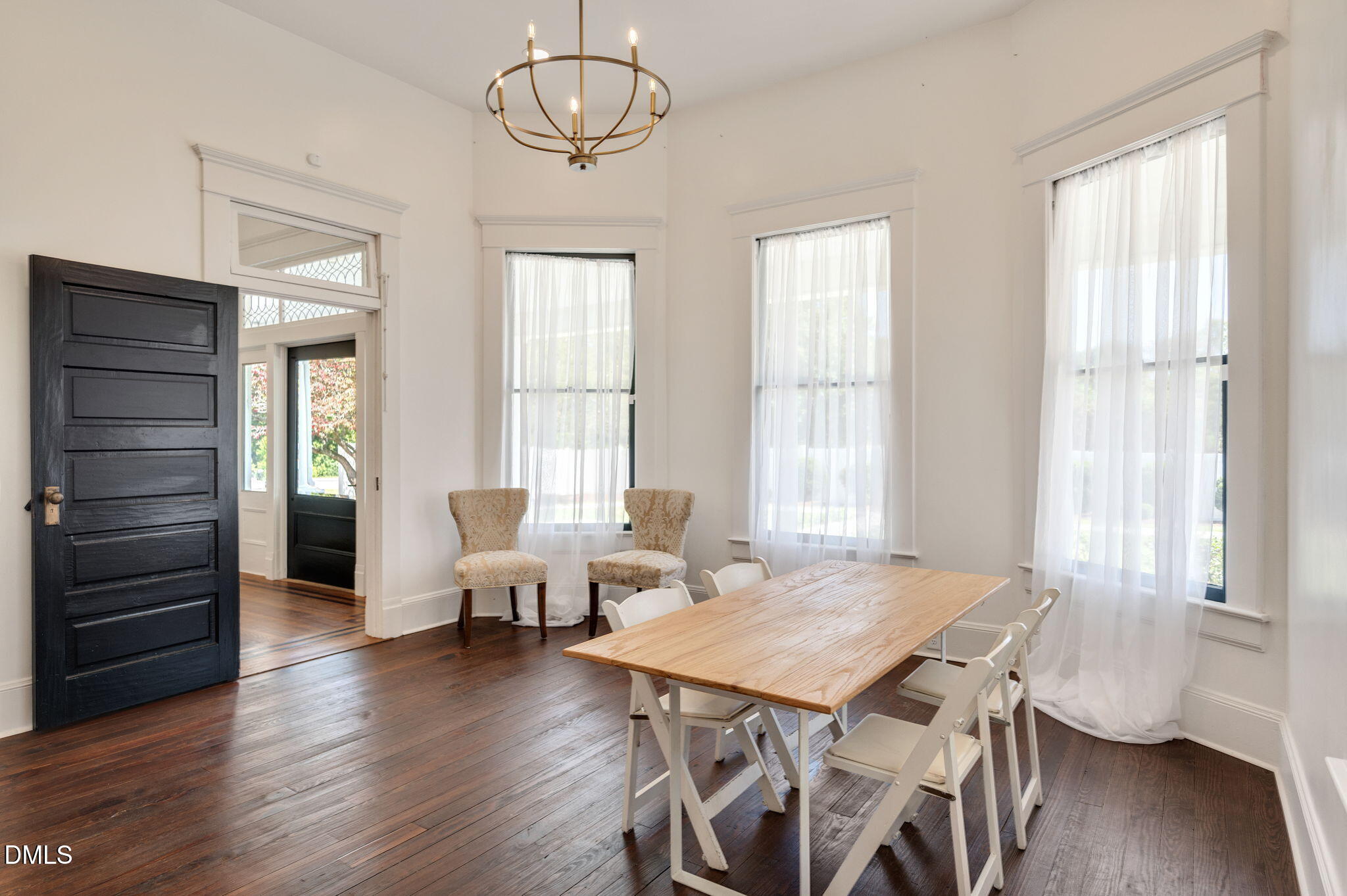 2239 Barber Mill Road Clayton, NC 27520 - Photo 30 of 75 a view of a dining room with furniture wooden floor and chandelier