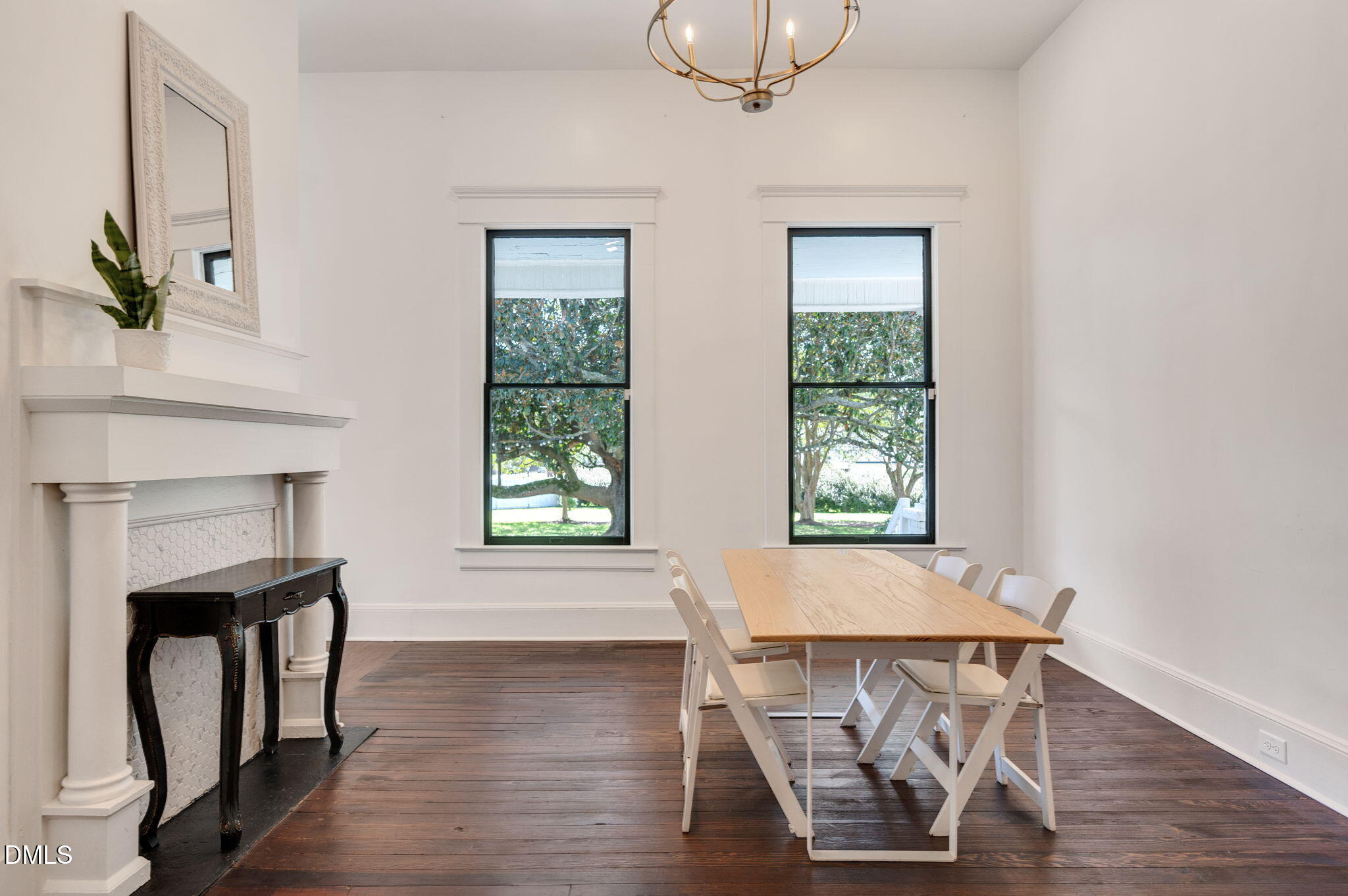 2239 Barber Mill Road Clayton, NC 27520 - Photo 32 of 75 a view of a dining room with furniture window and wooden floor