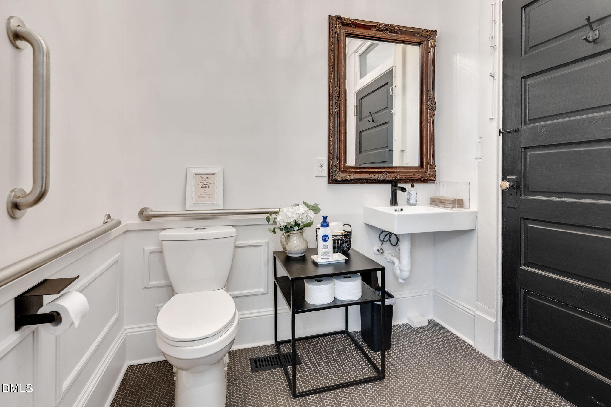 2239 Barber Mill Road Clayton, NC 27520 - Photo 38 of 75 a bathroom with a toilet sink and mirror