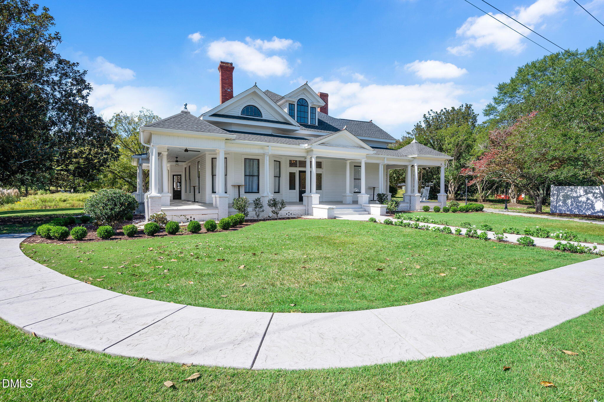 2239 Barber Mill Road Clayton, NC 27520 - Photo 4 of 75 a front view of a house with garden