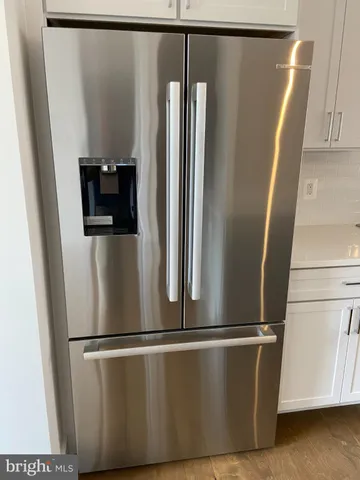 a view of a refrigerator in kitchen