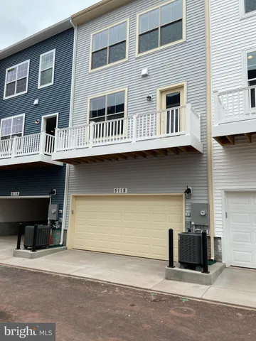 a front view of a building with many windows