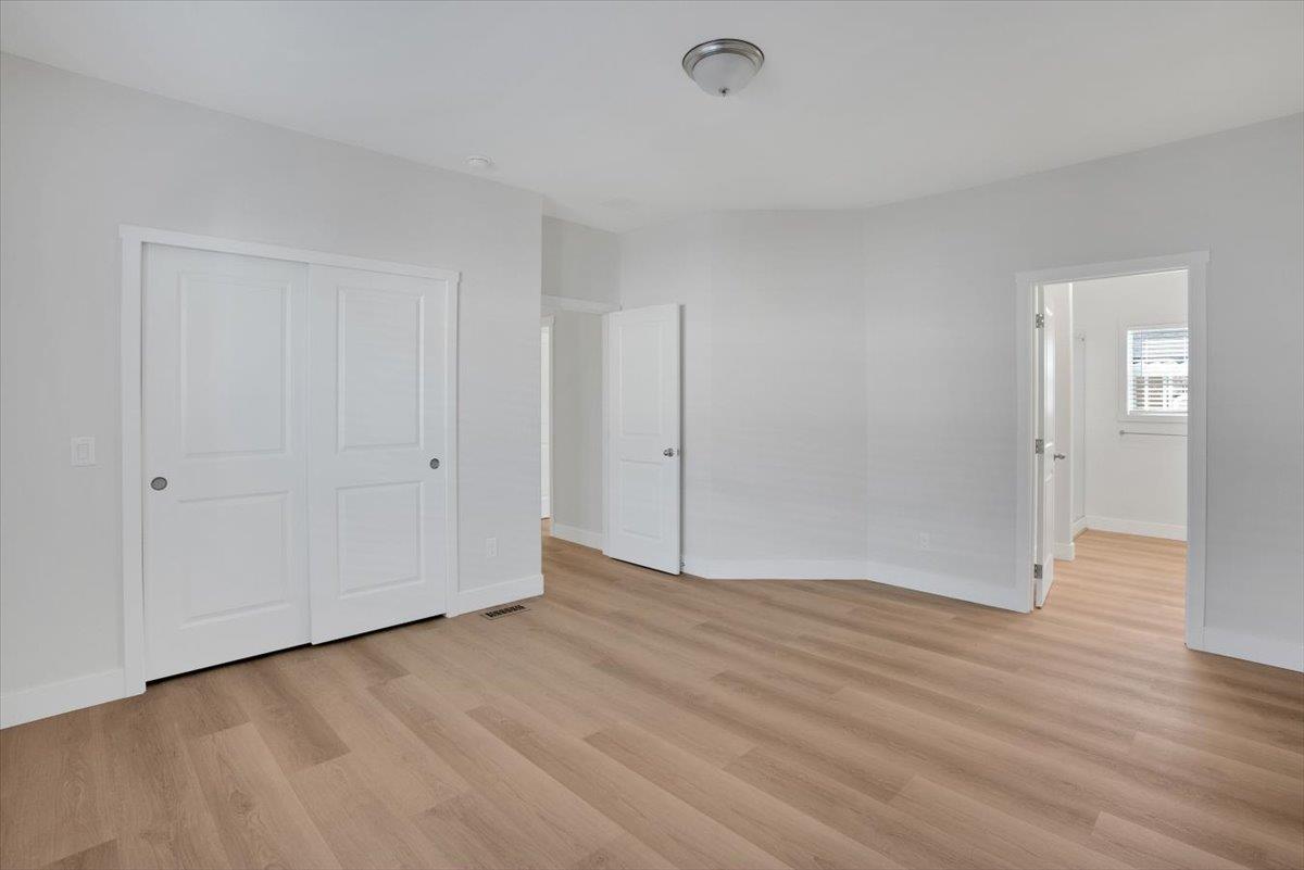 144 Holm Road, Unit 55 Watsonville, CA 95076 - Photo 11 of 24 a view of an empty room and wooden floor