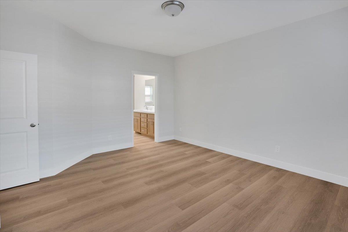144 Holm Road, Unit 55 Watsonville, CA 95076 - Photo 12 of 24 a view of an empty room and wooden floor