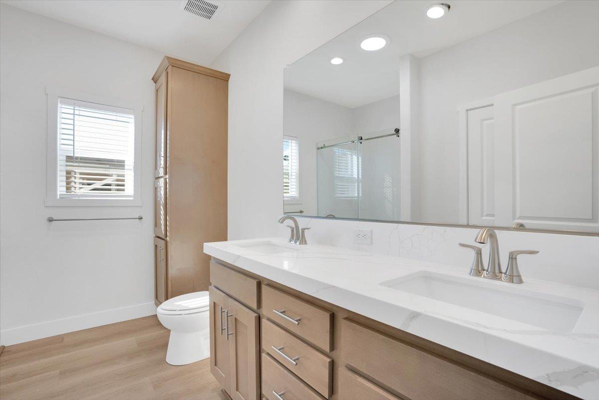 144 Holm Road, Unit 55 Watsonville, CA 95076 - Photo 13 of 24 a bathroom with a sink and a toilet