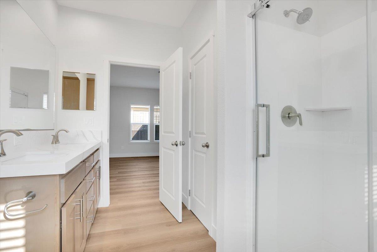 144 Holm Road, Unit 55 Watsonville, CA 95076 - Photo 14 of 24 a bathroom with a sink and mirror