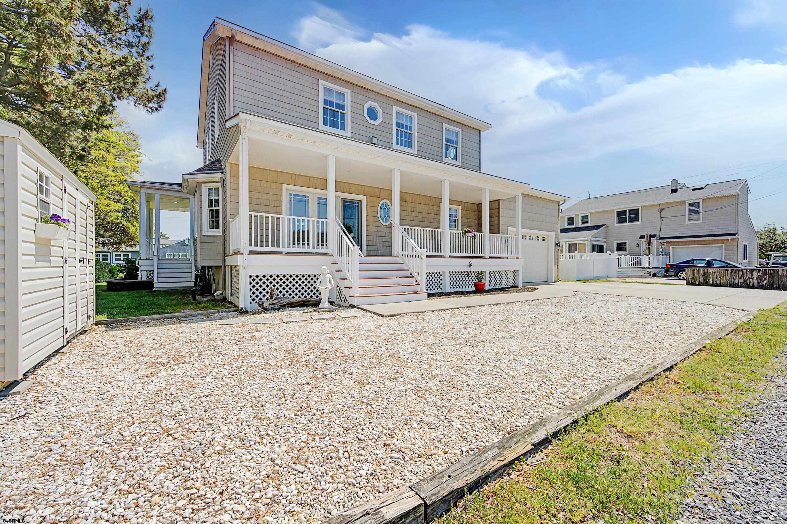 212 17th Street South Brigantine, NJ 08203 - Photo 29 of 37 a front view of a house with a yard