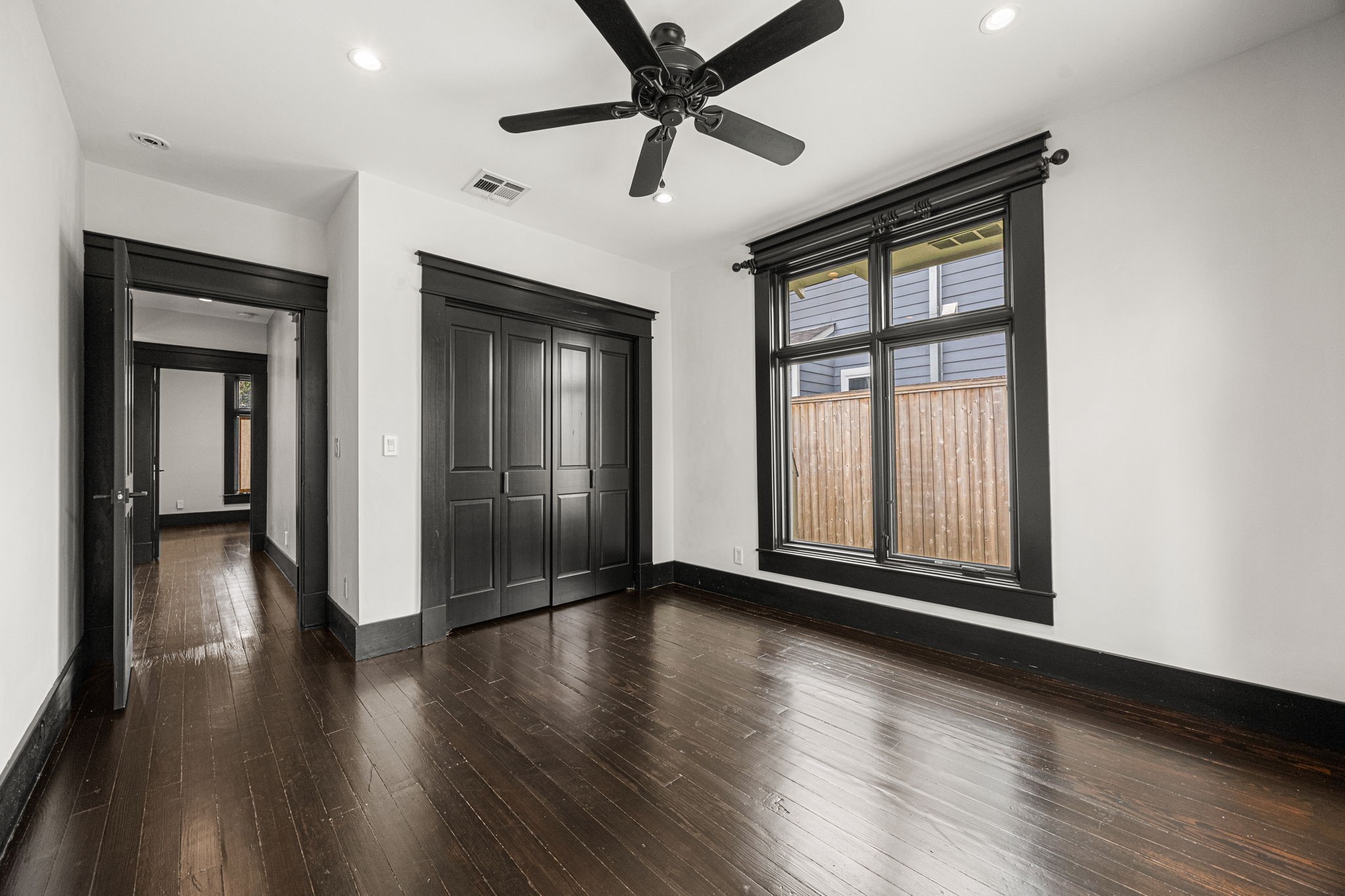 1115 Adele Street Houston, TX 77009 - Photo 10 of 19 Bedroom with ample natural light, closet space, and hardwood flooring.